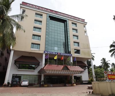 https://imgcld.yatra.com/ytimages/image/upload/t_hotel_yatra_city_desktop/v1440217914/Domestic Hotels/Hotels_Guruvayoor/Mayura Residency/Overview.jpg